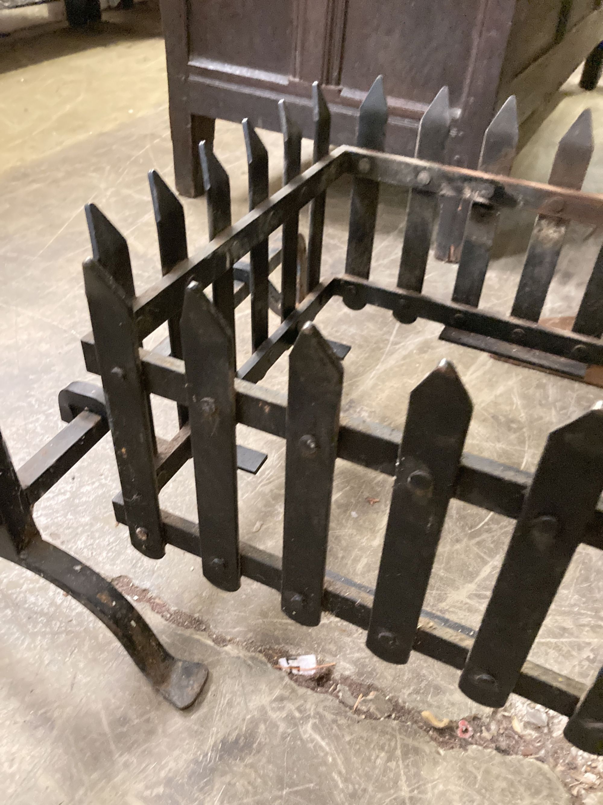 A rectangular wrought iron fire basket, width 114cm, depth 56cm, height 62cm and dogs